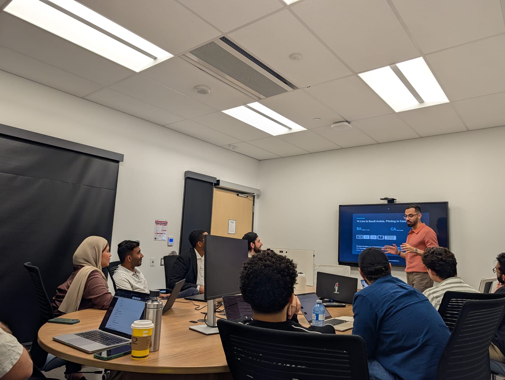 A founder presenting their company to the room.