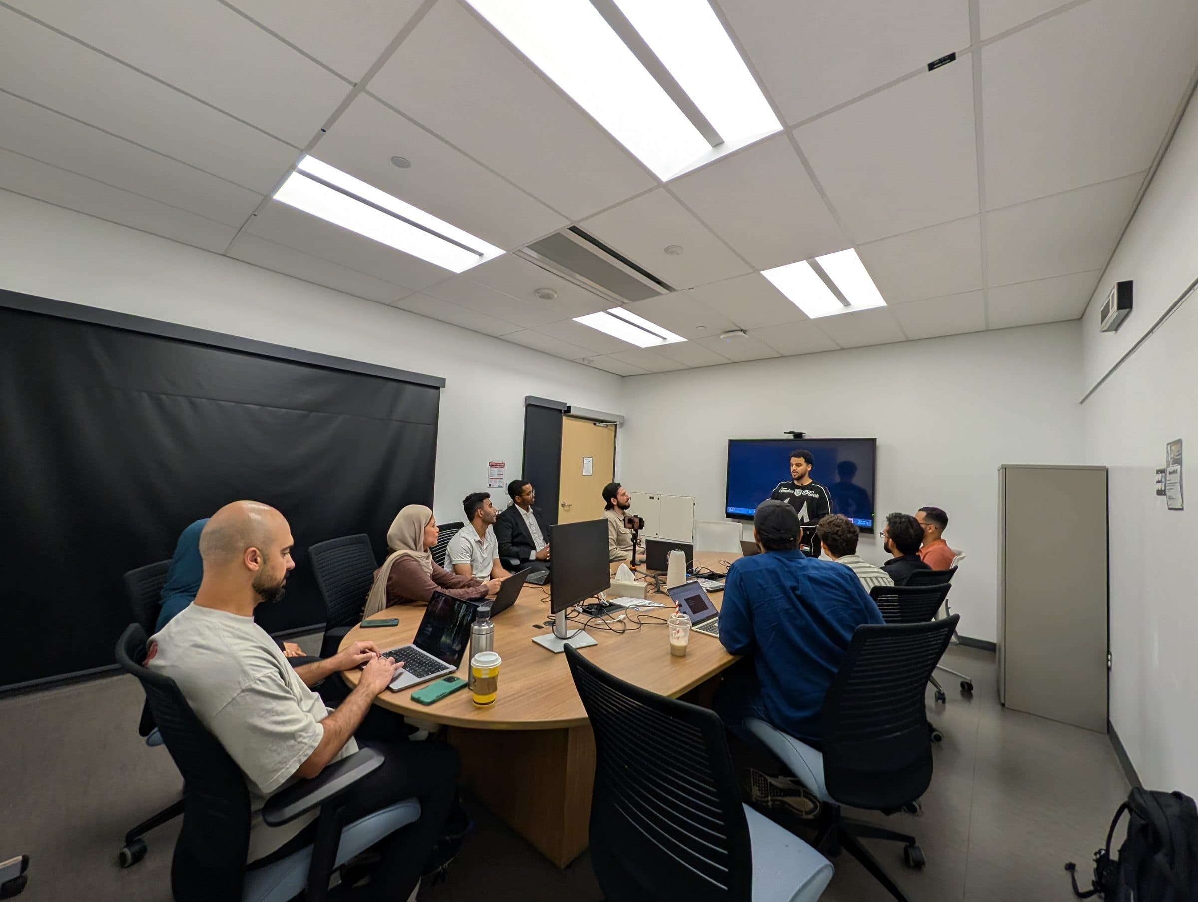 The cohort around the table during a working session.
